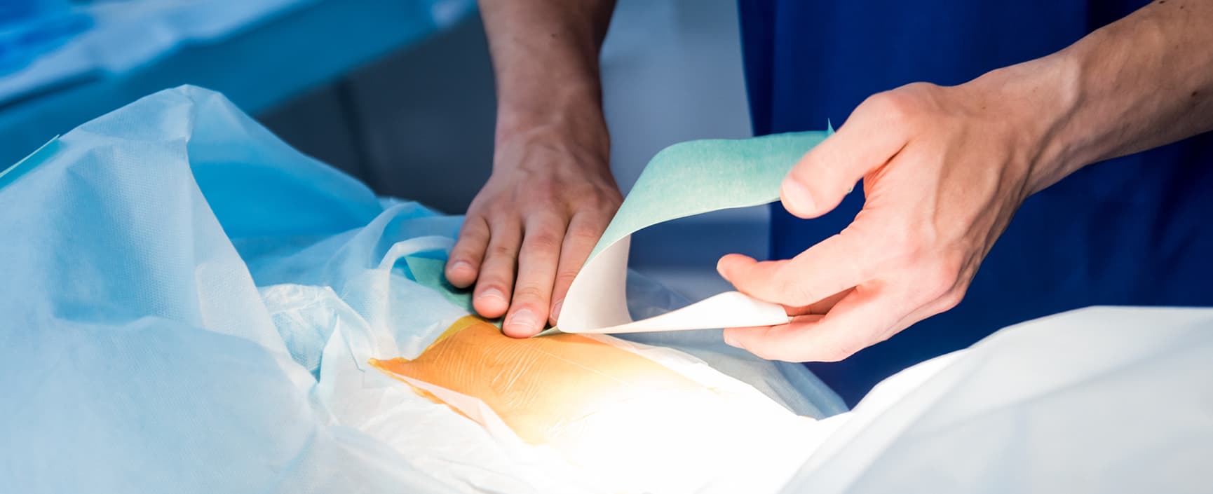 A doctor performs a procedure called dorsal root ganglion (or DRG) stimulation in a patient's back