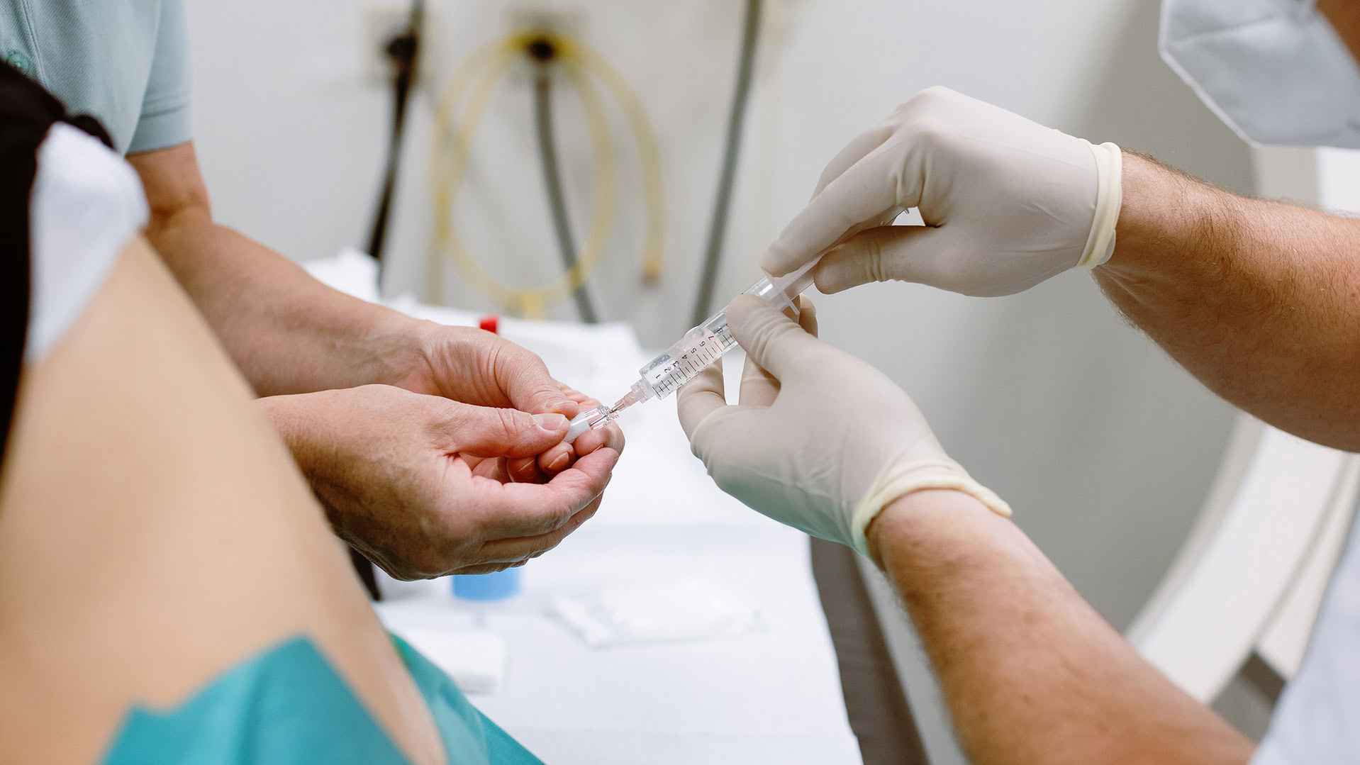 Doctor and nurse preparing syringe