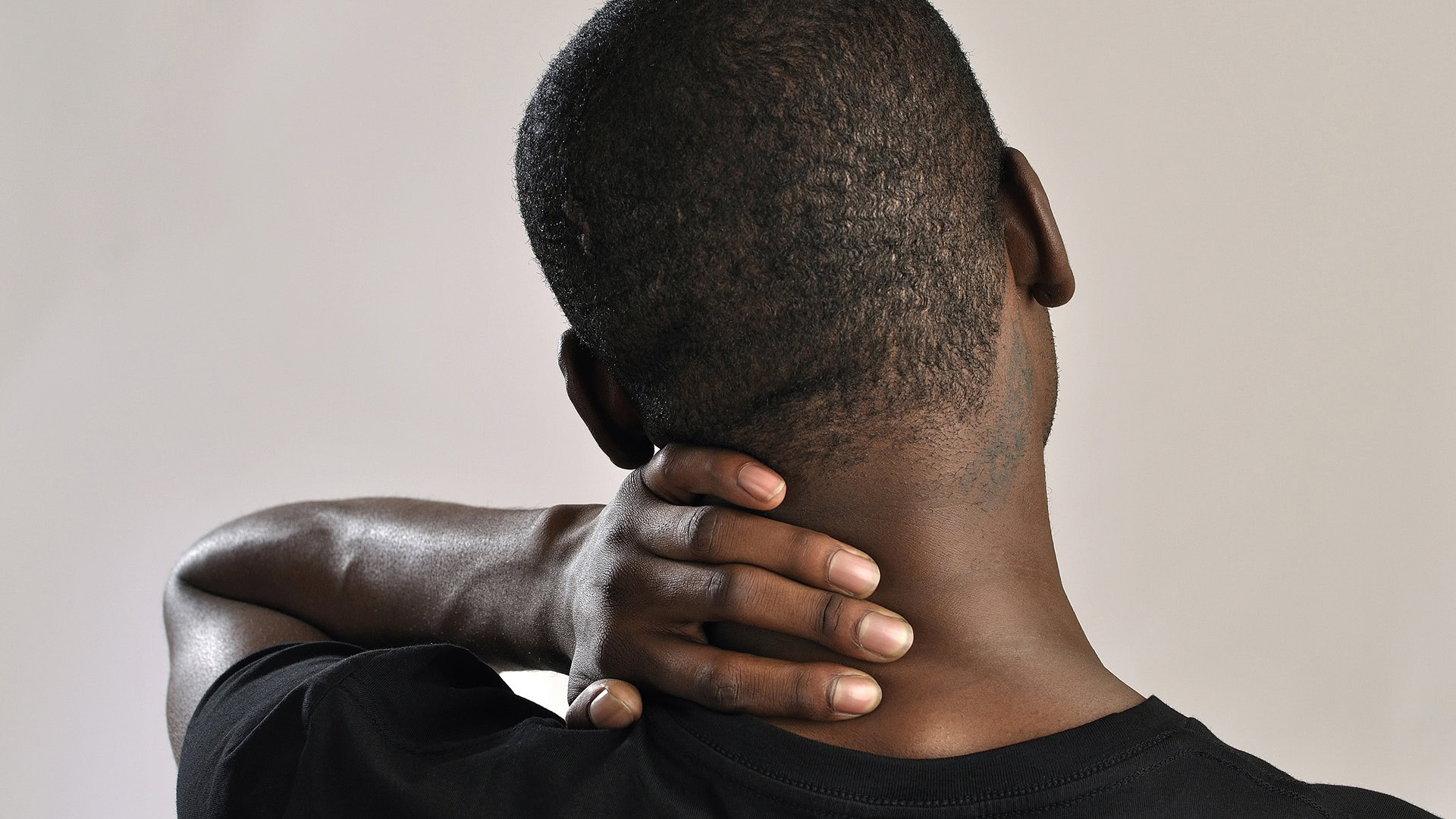 Man experiencing neck pain