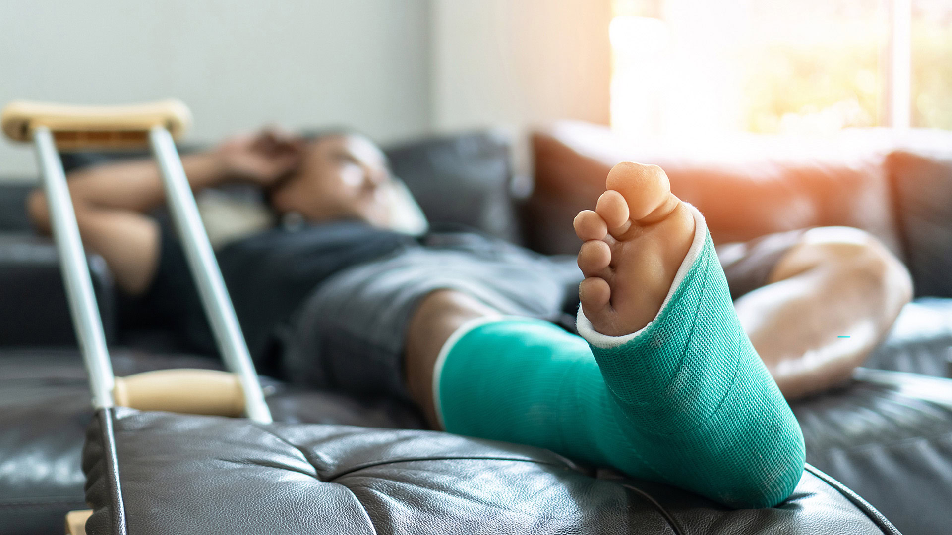 Patient with leg fracture in splint cast
