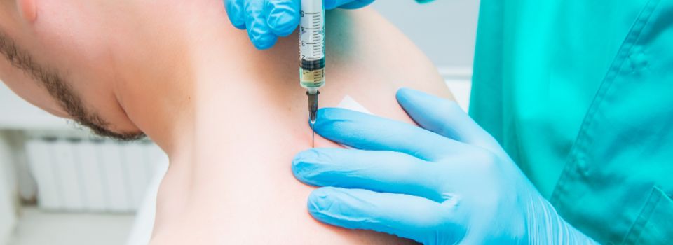 Patient receiving trigger point injection therapy.